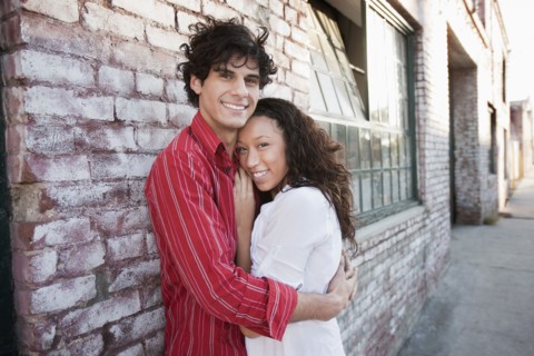 Couple hugging in urban area