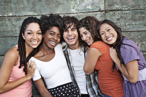 Smiling friends hugging