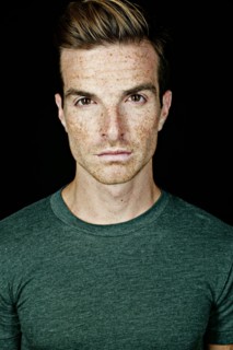Serious Caucasian man with freckles