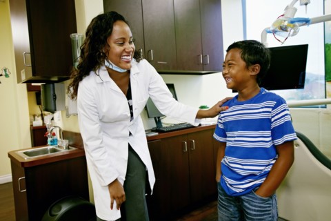 Dentist and patient in dental office