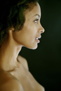 Nude mixed race woman smiling
