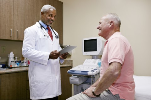 Doctor talking to patient in office