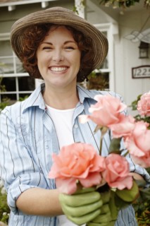 Smiling woman working in garden