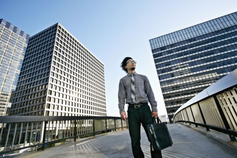 Asian businessman on urban walkway