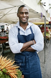 Black man working at outdoor market
