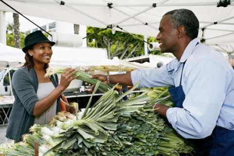 Black woman shopping at outdoor market
