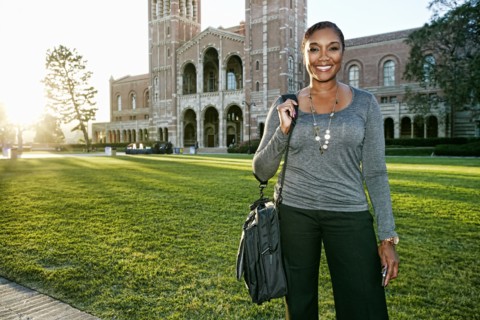 African American professor smiling on campus