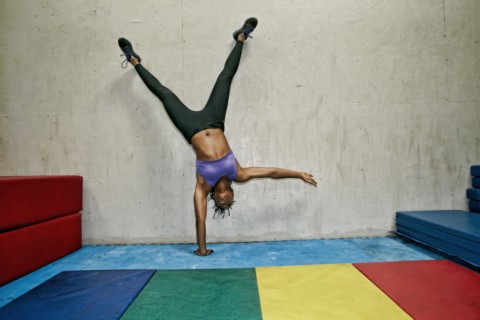 African American woman exercising in gym