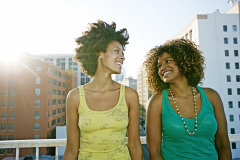 Mixed race women on urban rooftop
