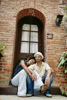 Couple smiling together on front stoop