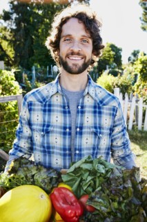 Caucasian man harvesting vegetables in garden