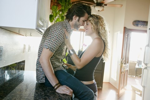 Couple hugging in kitchen