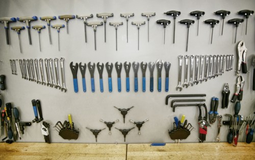 Tools arranged neatly on shop wall