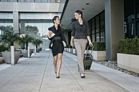 Businesswomen walking together outdoors