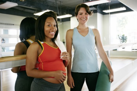 Women smiling in yoga studio