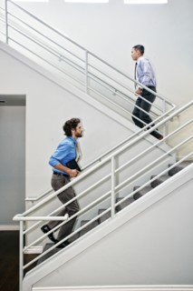 Businessmen climbing staircase