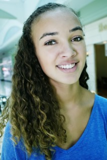 Close up of mixed race teenage girl smiling