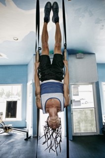 Asian man exercising in gym