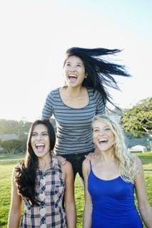 Women playing in field outdoors