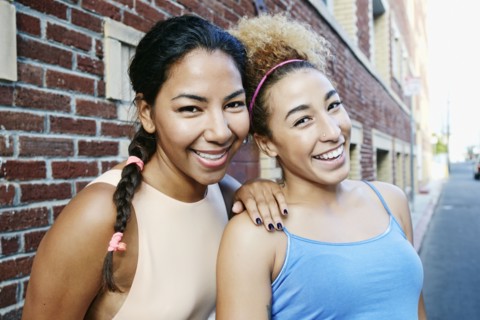 Hispanic women smiling in city