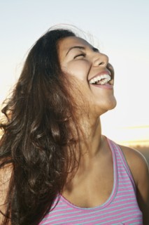Close up of Hispanic woman laughing