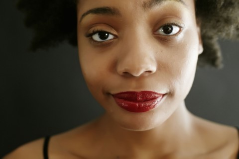 Close up of black woman smirking