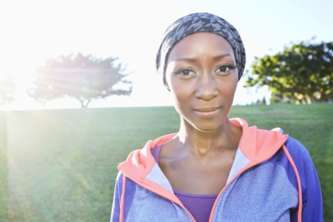 African American woman smiling in park