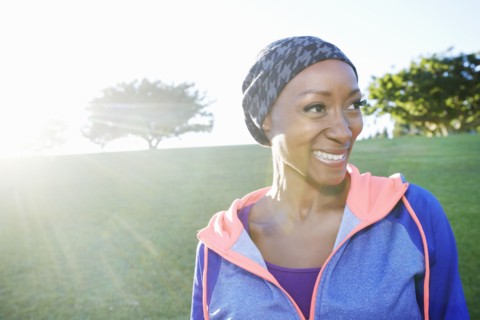 African American woman smiling in park