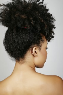 Rear view of mixed race woman looking over shoulder