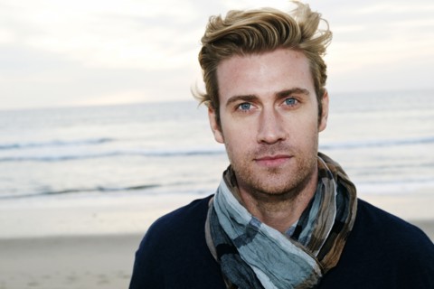 Caucasian man standing on beach