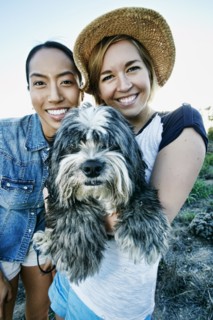 Close up of women smiling with dog