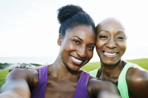 Women smiling in park
