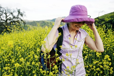 Caucasian woman standing in tall grass
