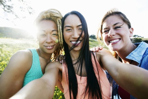 Friends taking selfie outdoors