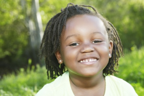 Black girl smiling outdoors