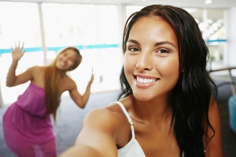 Smiling women posing indoors