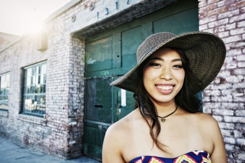Japanese woman smiling outdoors