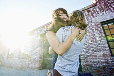 Couple hugging outdoors