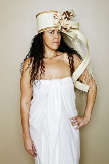Mixed race hula dancer wearing traditional costume
