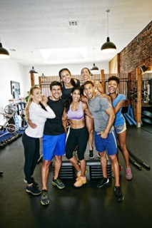 Friends smiling in gymnasium