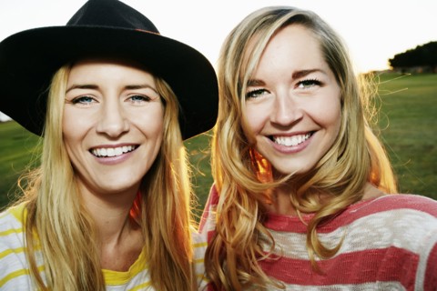 Caucasian women smiling in field
