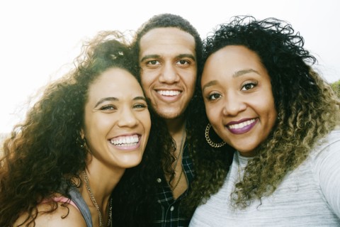 Friends smiling outdoors