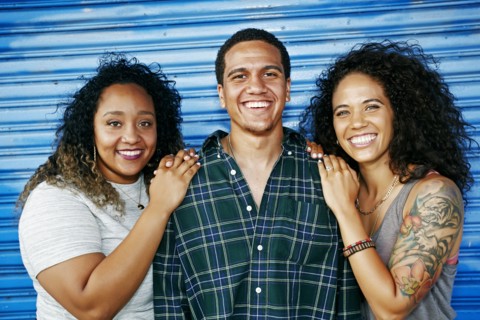 Friends smiling at garage door