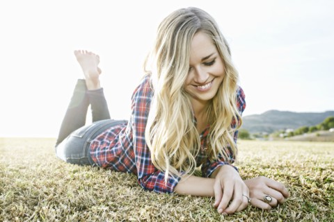 Caucasian woman laying in park