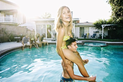Couple playing in swimming pool