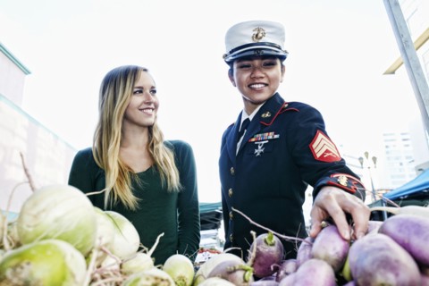 Soldier and friend shopping in farmers market