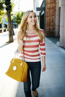 Caucasian woman walking on sidewalk