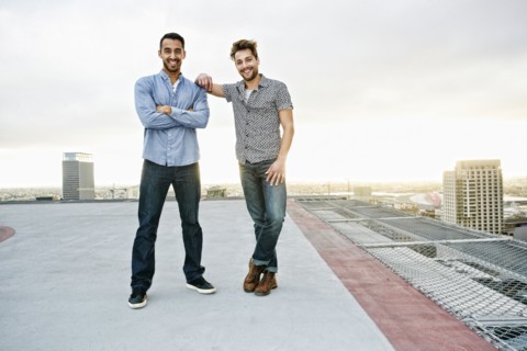 Stylish men posing on urban rooftop