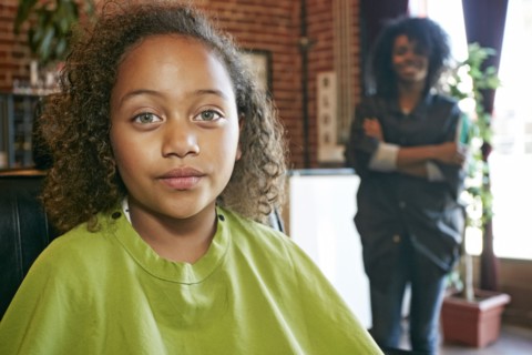Serious customer with hairdresser in hair salon