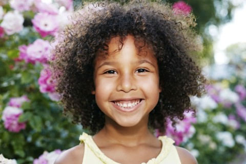 Mixed Race girl smiling outdoors